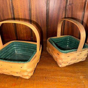 2 Longaberger baskets. 5” x 5”. Handle. Plastic and cloth liner.